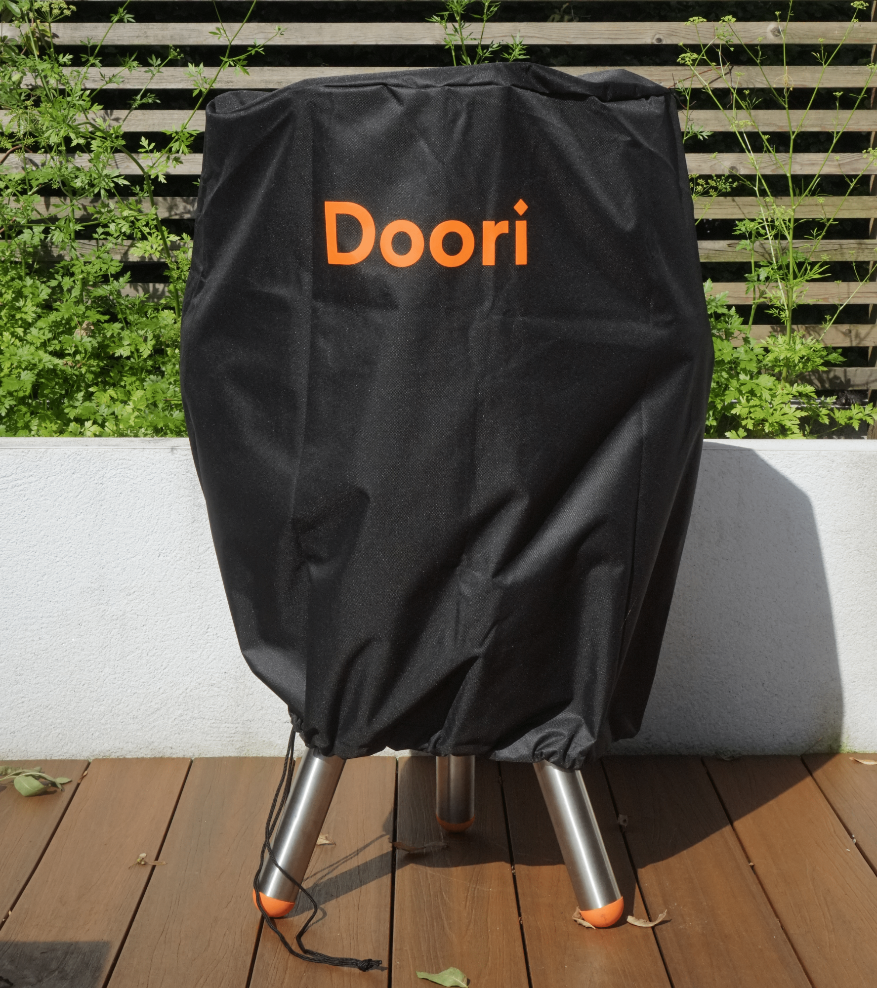 The Doori with the Doori Weather Cover on outside on a deck.